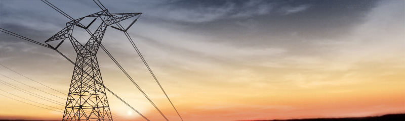 tralicci al tramonto con la scritta Etelec electrical technology